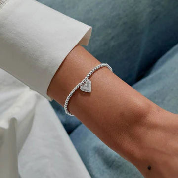A LITTLE HERES TO YOUR NEXT CHAPTER BRACELET