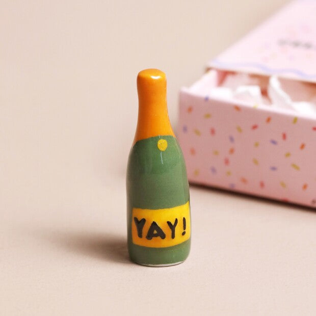 TINY MATCHBOX CERAMIC CHAMPAGNE TOKEN